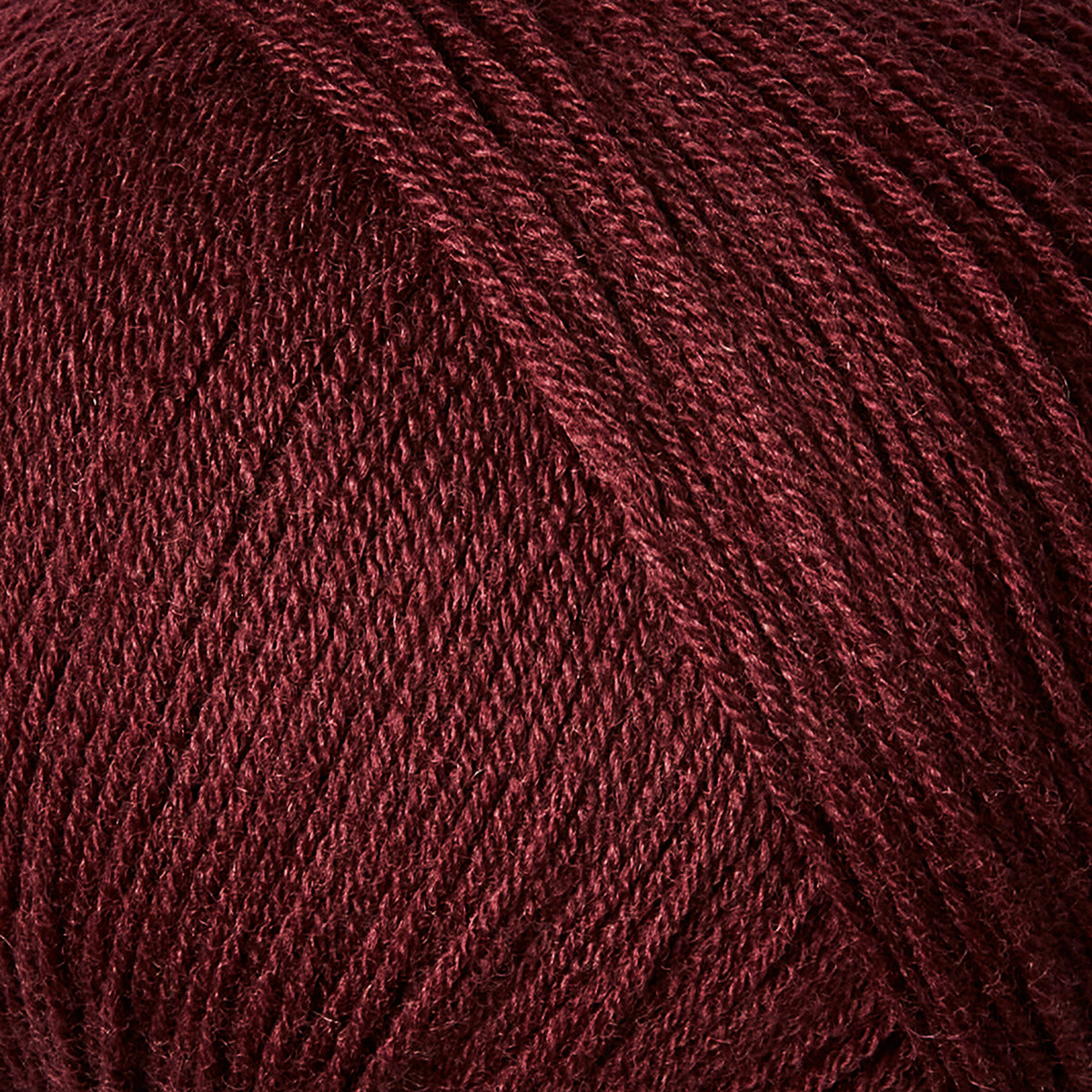 Close-up of Knitting for Olive Merino yarn in Bordeaux