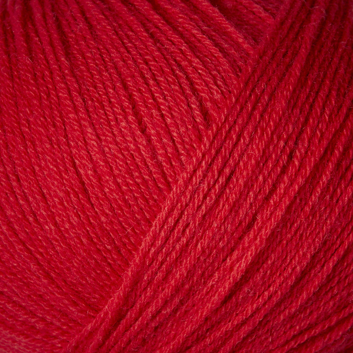 Close-up of Knitting for Olive Merino yarn in Red Currant
