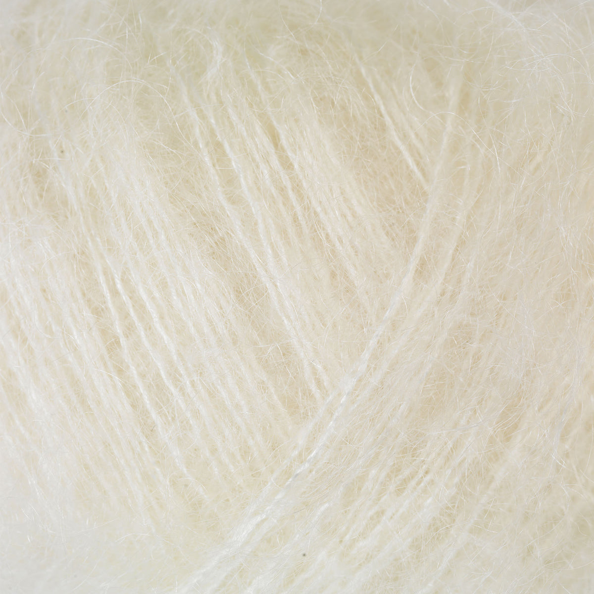 Close-up of Knitting for Olive Soft Silk Mohair yarn in Undyed